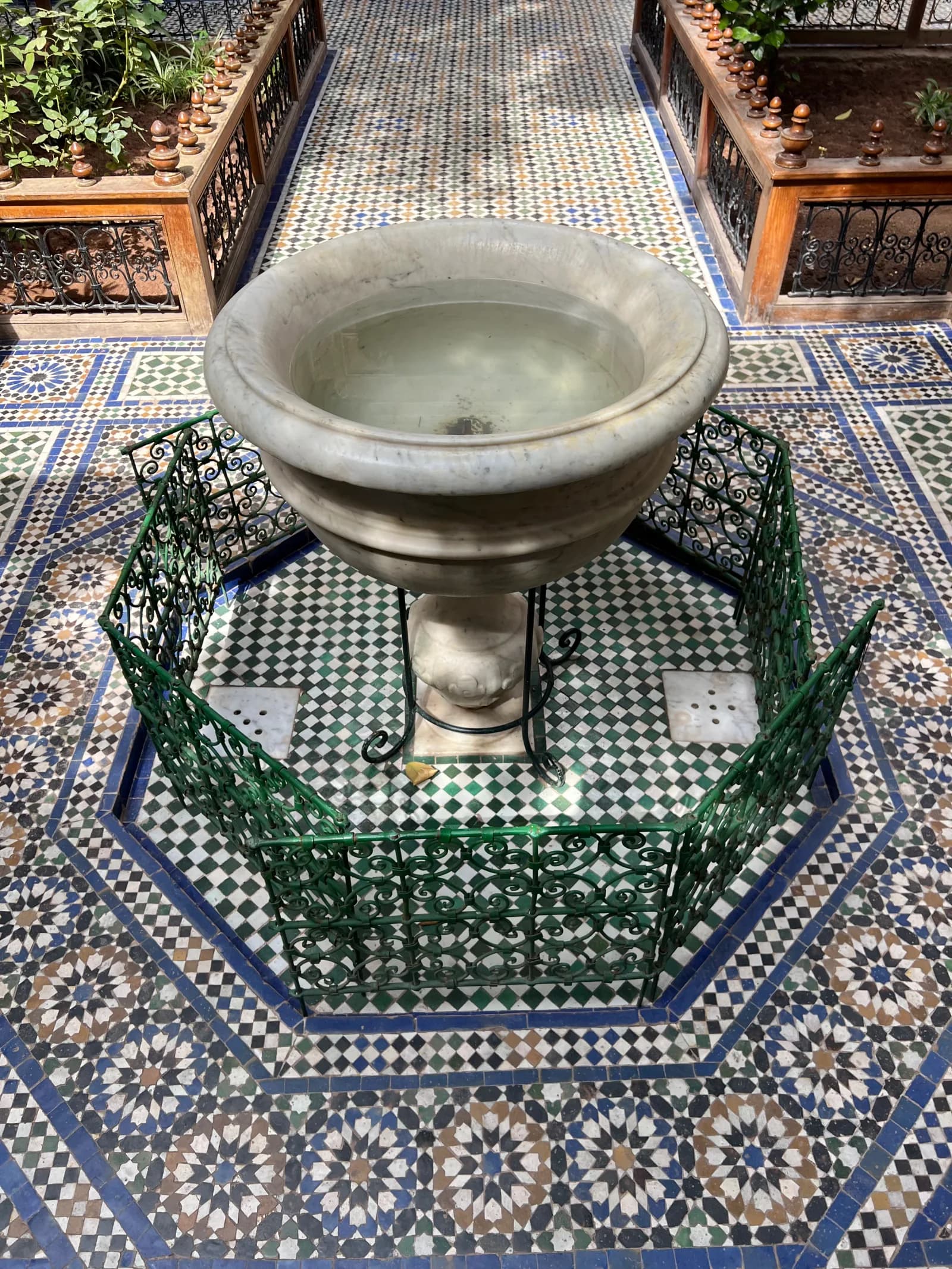 Grand courtyard with marble fountain and zellige garden at Bahia Palace