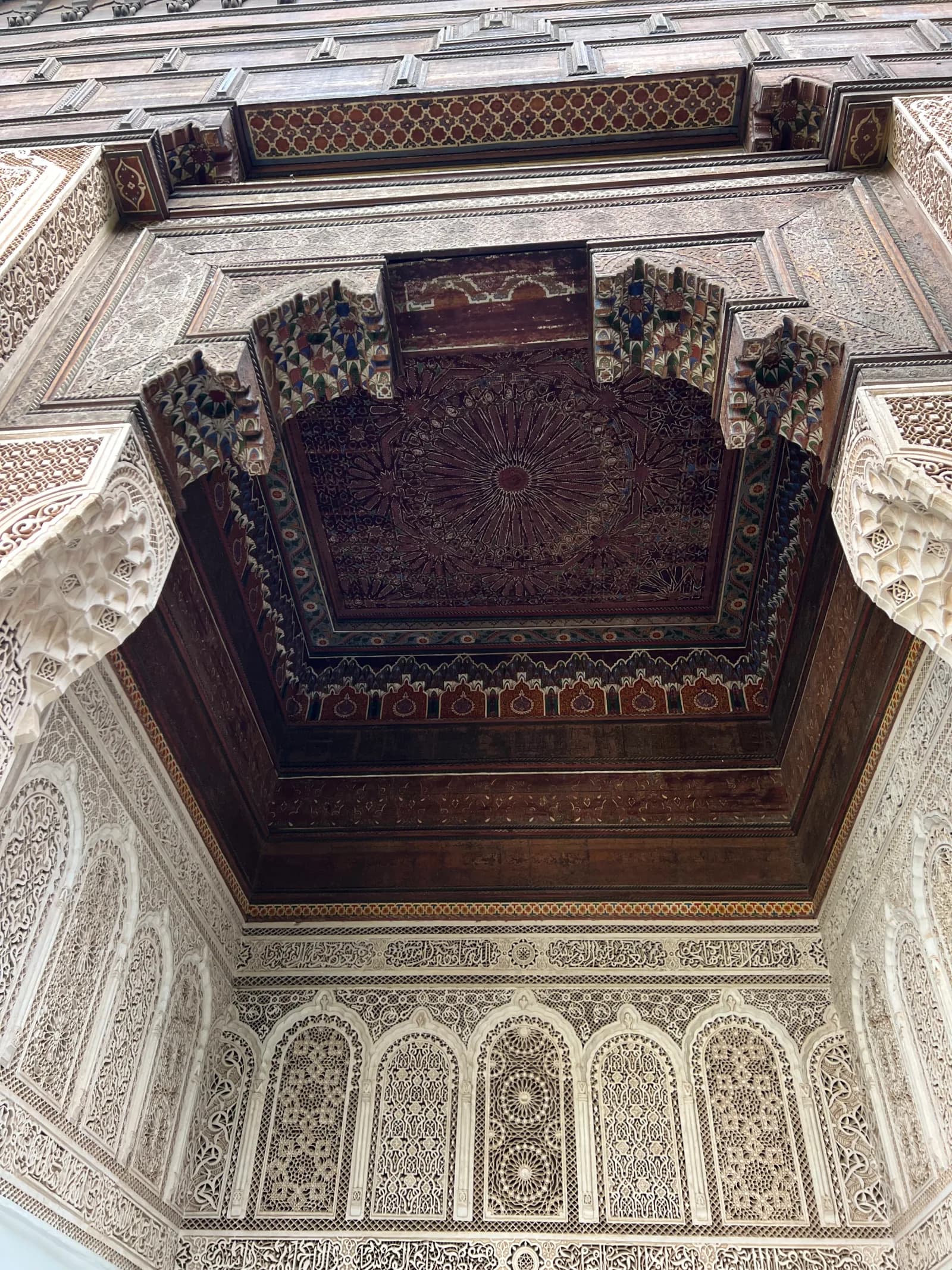 Muqarnas cedar ceiling with carved plaster arches at Bahia Palace